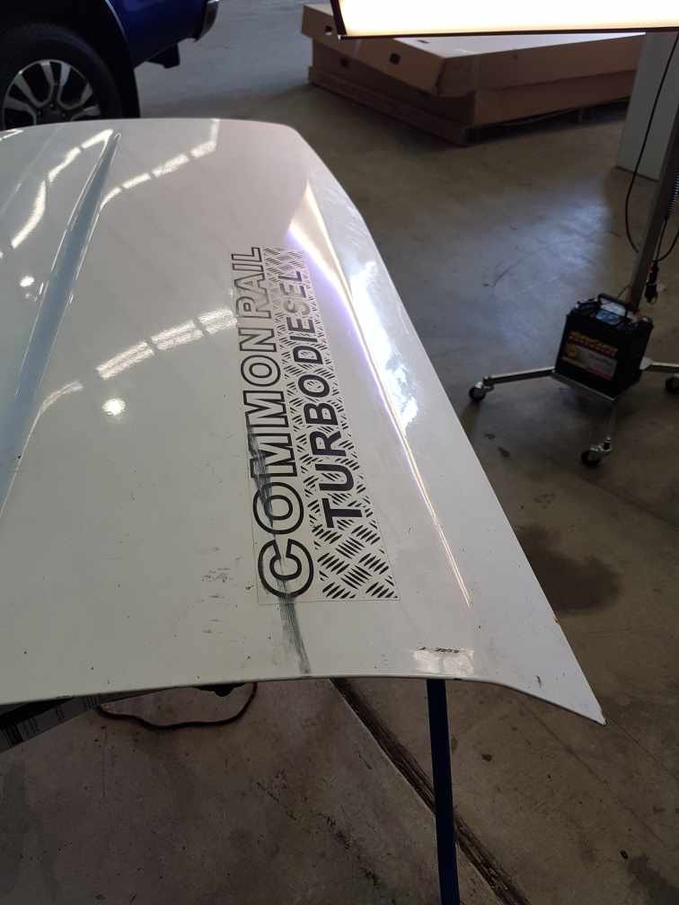 Commodore bonnet dent (after paintless repair)